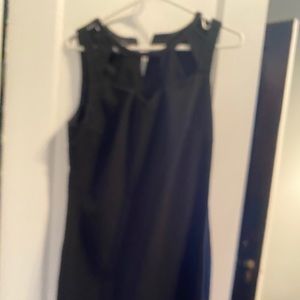 Knee length black dress.